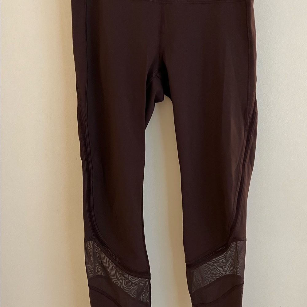 Lululemon cropped leggings with mesh accents.